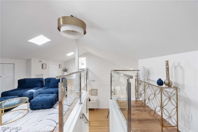 interior space featuring vaulted ceiling and hardwood / wood-style floors