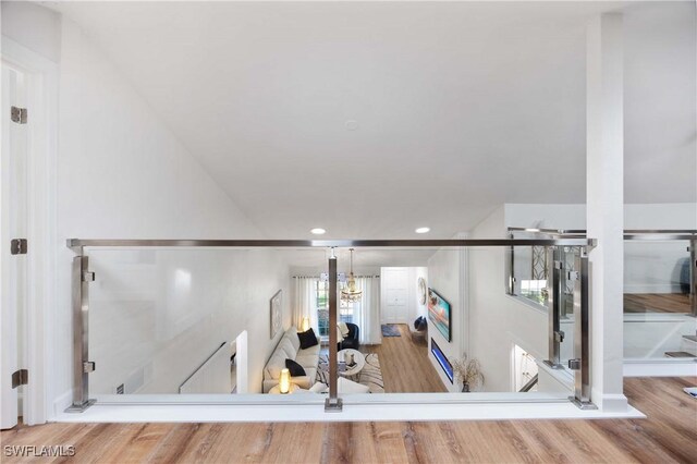 staircase featuring wood-type flooring