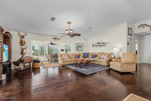 living room featuring lofted ceiling, dark wood-type flooring, and ceiling fan