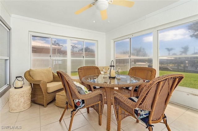 sunroom / solarium featuring ceiling fan