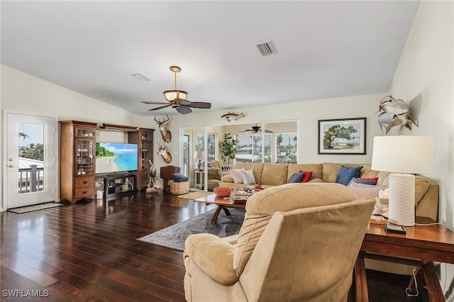 living room with ceiling fan, lofted ceiling, and dark hardwood / wood-style floors