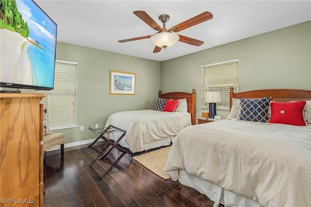 bedroom featuring dark hardwood / wood-style floors and ceiling fan