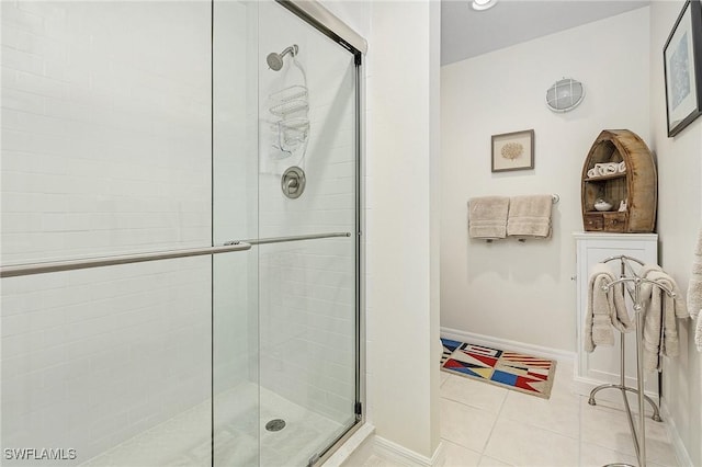 bathroom featuring tile patterned flooring and walk in shower