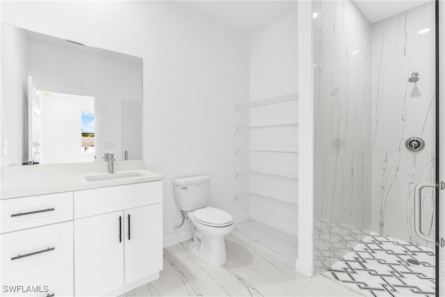 bathroom with vanity, a shower with shower door, and toilet