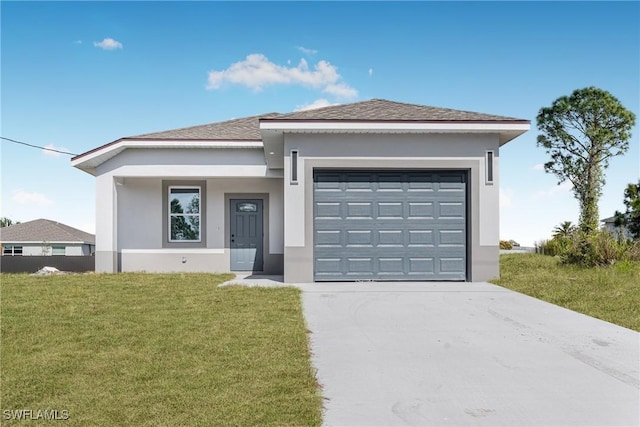 view of front of house with a garage and a front yard