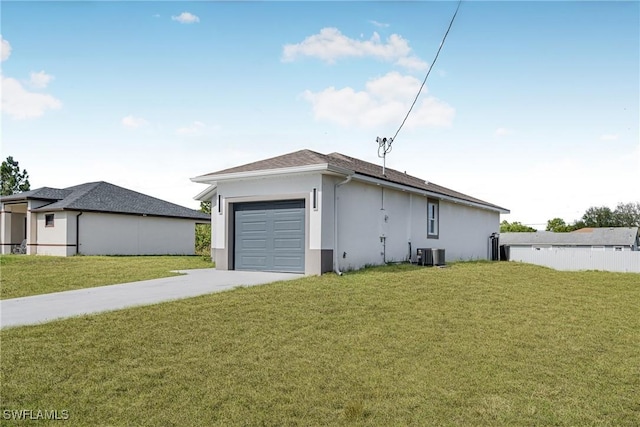 view of side of home with a yard, a garage, and central air condition unit