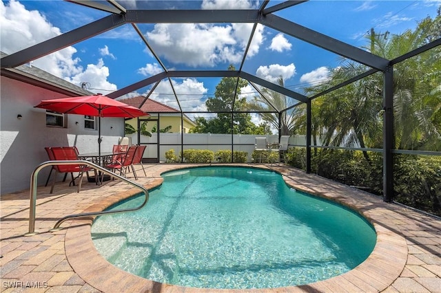 view of pool featuring a lanai and a patio area