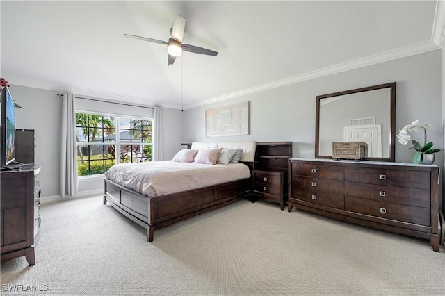 bedroom with crown molding, light carpet, and ceiling fan