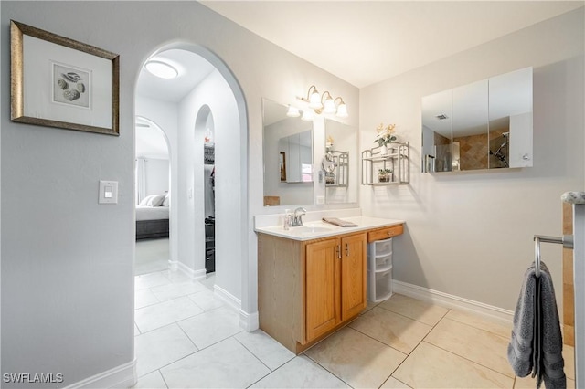 bathroom with tile patterned flooring and vanity