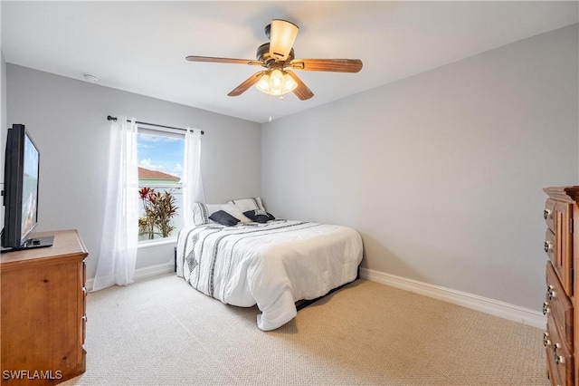 bedroom featuring ceiling fan and light colored carpet