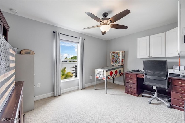 office space with light carpet and ceiling fan