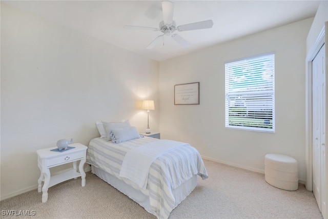 carpeted bedroom with ceiling fan