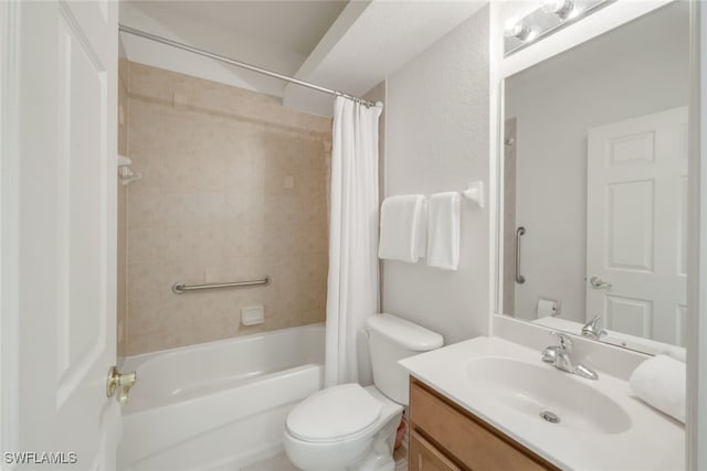 full bathroom with vanity, shower / tub combo, and toilet