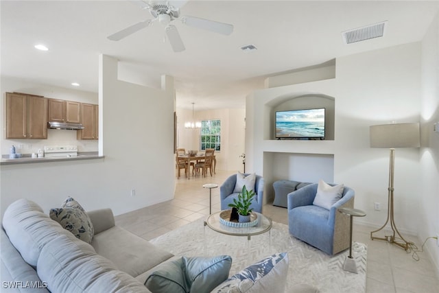 tiled living room with ceiling fan