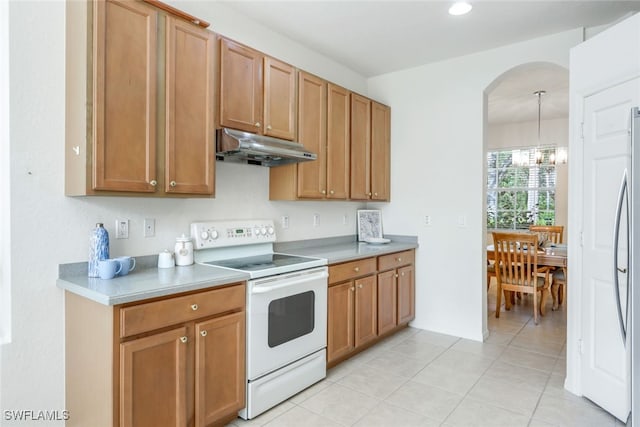 kitchen featuring white electric stove, light tile patterned flooring, a chandelier, and decorative light fixtures