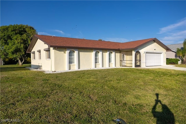 ranch-style house with a garage and a front yard