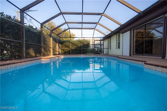 view of pool with a lanai