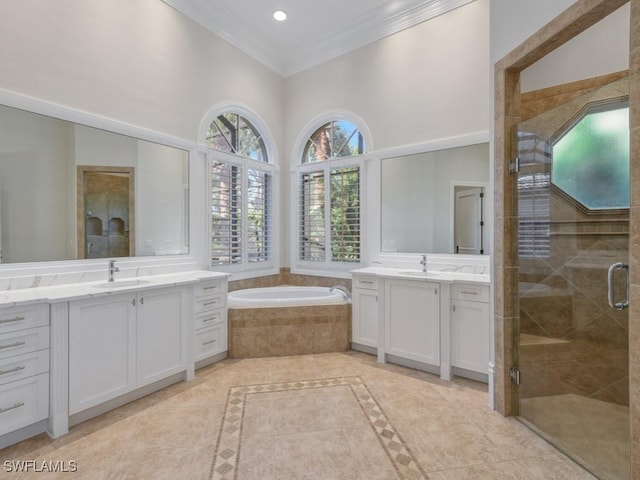 bathroom with independent shower and bath, crown molding, a healthy amount of sunlight, and vanity