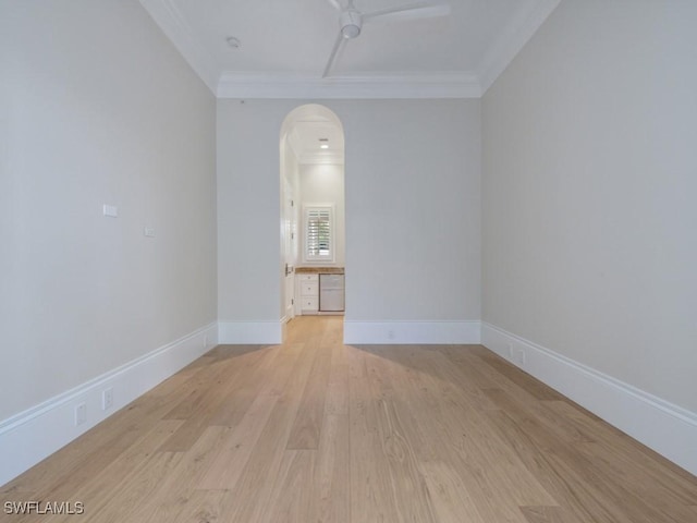 unfurnished room featuring crown molding, ceiling fan, and light hardwood / wood-style flooring