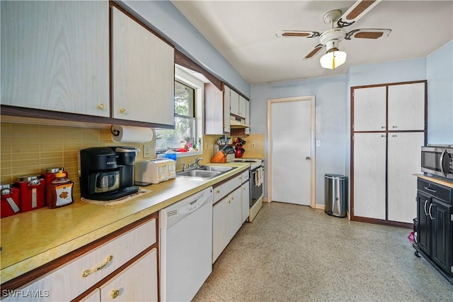 kitchen with sink, white appliances, ceiling fan, white cabinetry, and tasteful backsplash