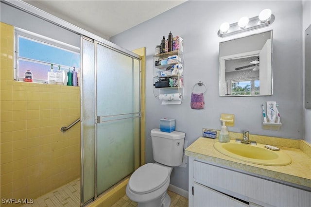 bathroom featuring walk in shower, vanity, and toilet