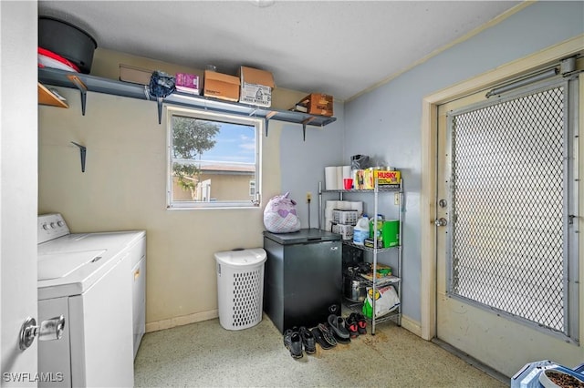 laundry room featuring separate washer and dryer