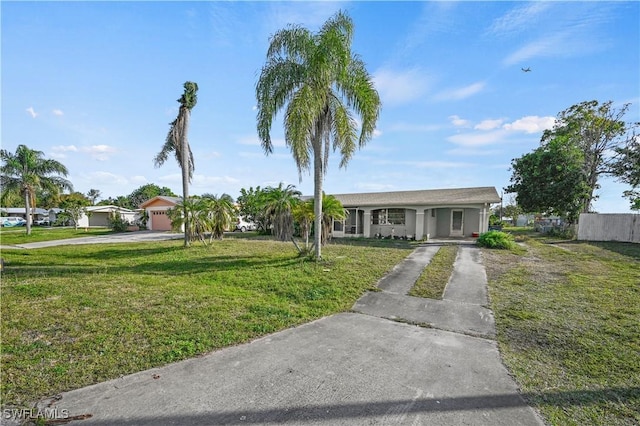 single story home with a garage and a front yard