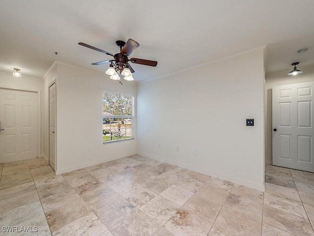 spare room with crown molding and ceiling fan