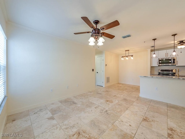 spare room with ceiling fan