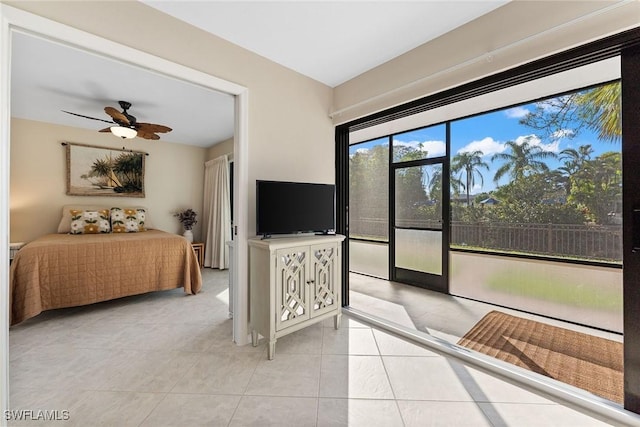 bedroom featuring light tile patterned floors and access to outside