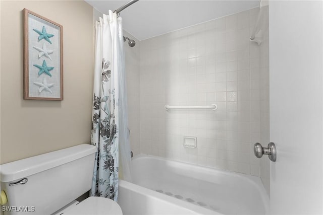 bathroom with shower / tub combo and toilet