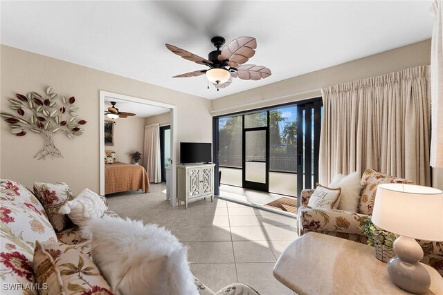 tiled living room with ceiling fan