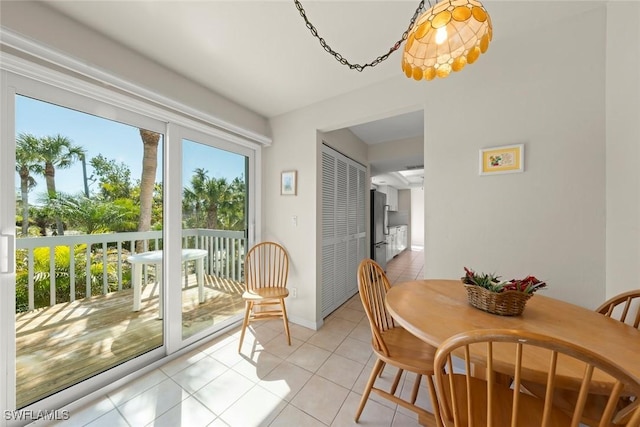 dining area with light tile patterned flooring