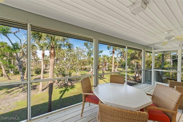 sunroom / solarium featuring ceiling fan