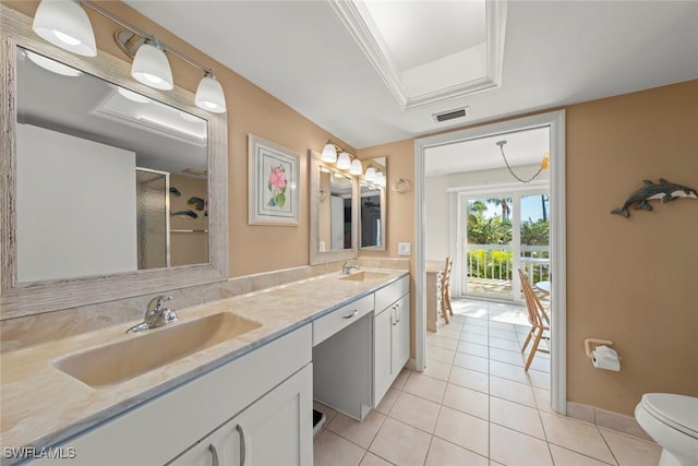 bathroom featuring an enclosed shower, vanity, tile patterned flooring, and toilet