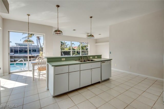 kitchen featuring light tile patterned floors, sink, dishwasher, a kitchen island with sink, and white cabinets