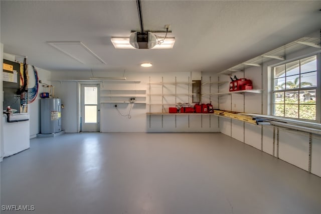 garage featuring a garage door opener and electric water heater