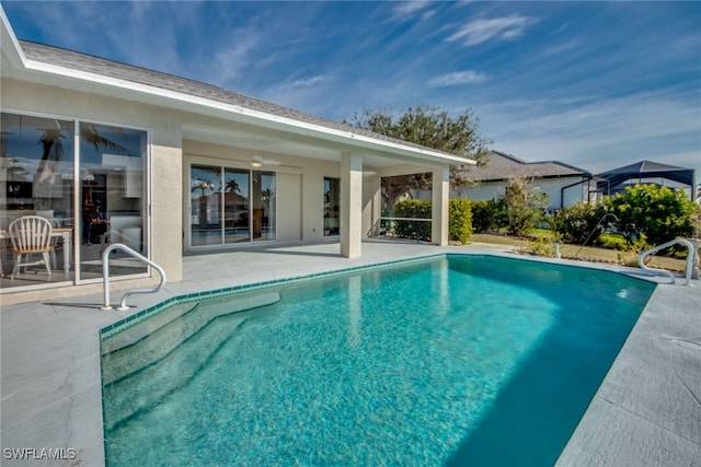 view of swimming pool with a patio