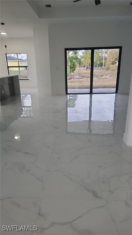 spare room featuring visible vents and marble finish floor