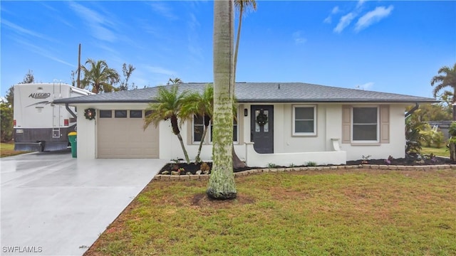 view of front facade with a garage and a front lawn