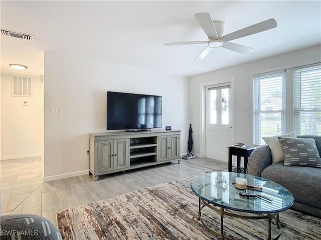 living room featuring ceiling fan