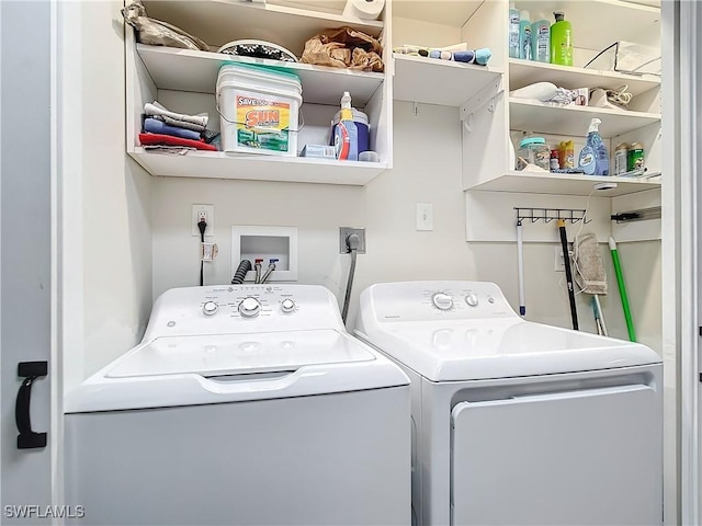 washroom with washer and dryer