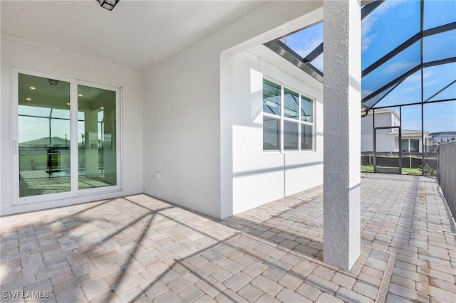 view of patio / terrace with glass enclosure