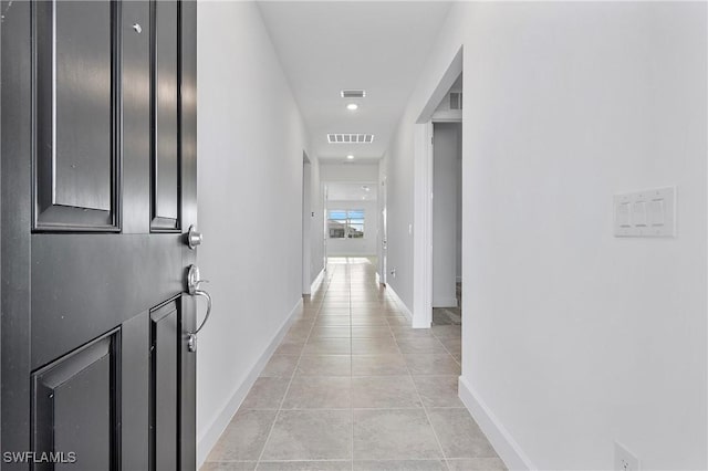 hallway with light tile patterned flooring