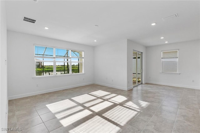 unfurnished room with light tile patterned floors