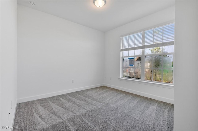 empty room with carpet flooring