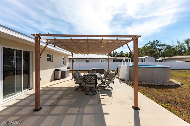 view of patio / terrace featuring a fenced in pool and a pergola