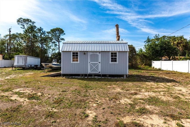 view of outdoor structure with a yard