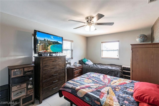 bedroom featuring multiple windows and ceiling fan