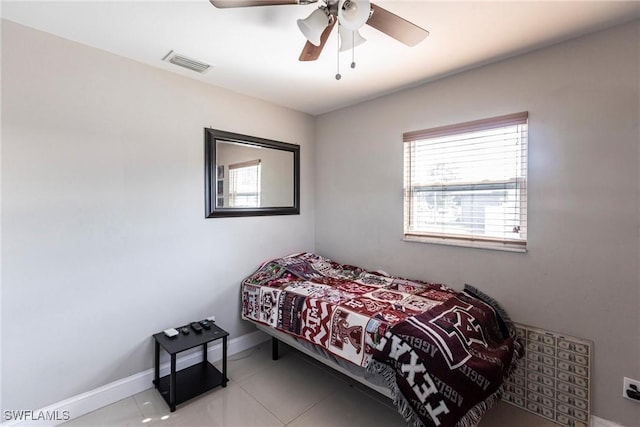 bedroom with light tile patterned floors and ceiling fan